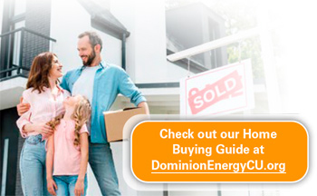 Family in front of a home sold sign